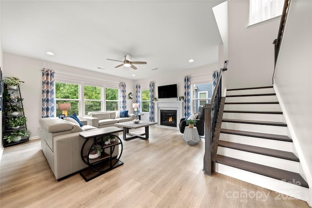 1918 Thoreau Way, York, SC 29745 - living area with a ceiling fan, a warm lit fireplace, plenty of natural light, light wood-style floors, and recessed lighting