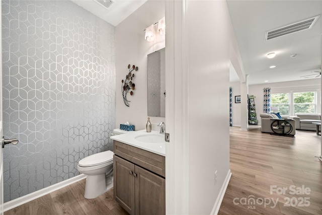 1918 Thoreau Way, York, SC 29745 - half bathroom featuring wood finished floors, vanity, toilet, and baseboards