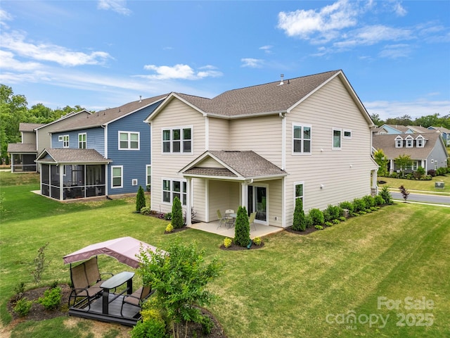 1918 Thoreau Way, York, SC 29745 - back of house with a patio, a sunroom, a yard, and a shingled roof