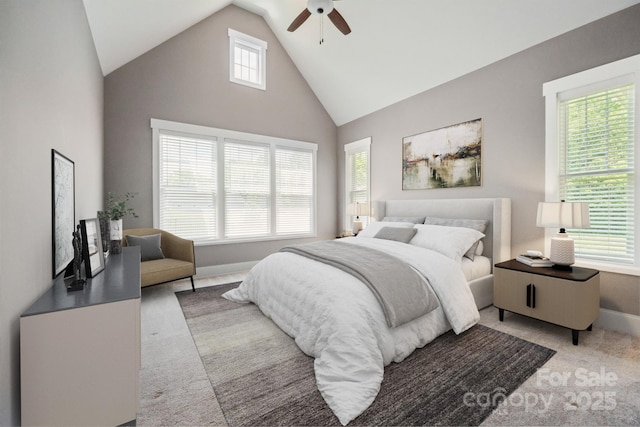 bedroom featuring high vaulted ceiling, carpet, baseboards, and a ceiling fan