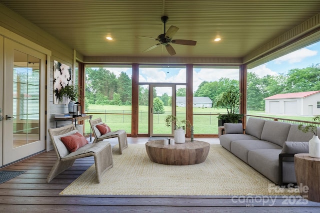 sunroom with an outdoor hangout area, healthy amount of natural light, and ceiling fan