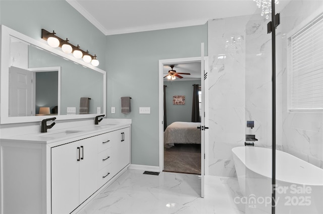 8 Secrest Dr, Arden, NC 28704 - full bath with ensuite bath, marble tiled floors, double vanity, a freestanding tub, and a ceiling fan
