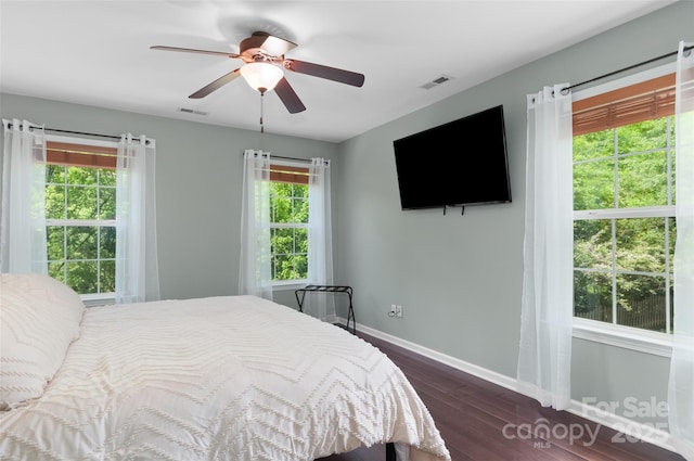 8 Secrest Dr, Arden, NC 28704 - bedroom with baseboards, dark wood finished floors, multiple windows, and ceiling fan