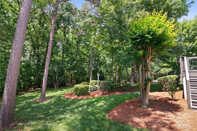 10616 Back Ridge Rd, Charlotte, NC 28277 - view of grassy yard featuring stairway and a wooden deck