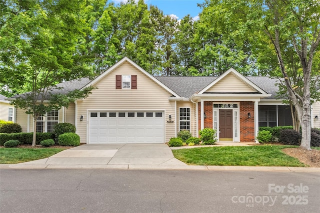 9430 Duckhorn Dr, Charlotte, NC 28277 - view of front of house with driveway, a garage, a shingled roof, brick siding, and a front lawn