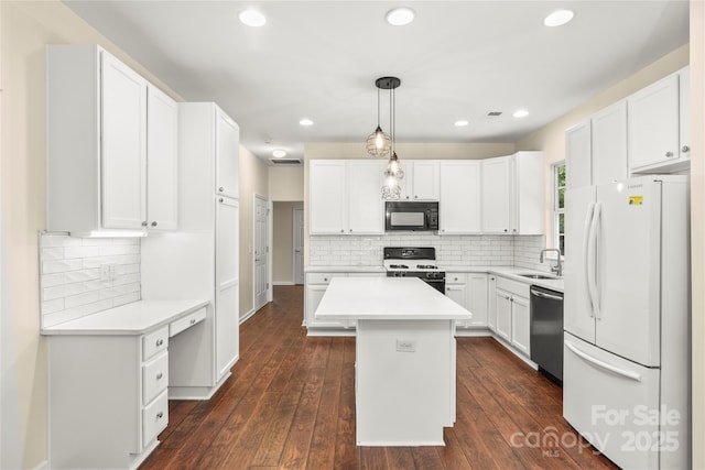 9430 Duckhorn Dr, Charlotte, NC 28277 - kitchen with white appliances, white cabinets, backsplash, and recessed lighting