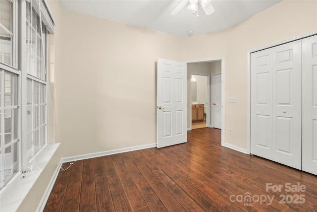 9430 Duckhorn Dr, Charlotte, NC 28277 - unfurnished bedroom with dark wood-style floors, a closet, and a ceiling fan