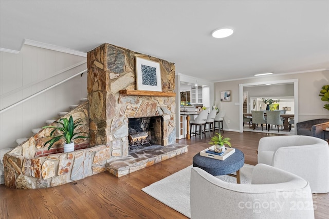 230 Shady Cove Rd, Troutman, NC 28166 - living room with ornamental molding, a fireplace, wood finished floors, and stairway