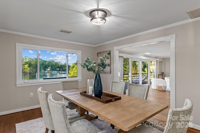 230 Shady Cove Rd, Troutman, NC 28166 - dining area featuring ornamental molding, wood finished floors, and baseboards