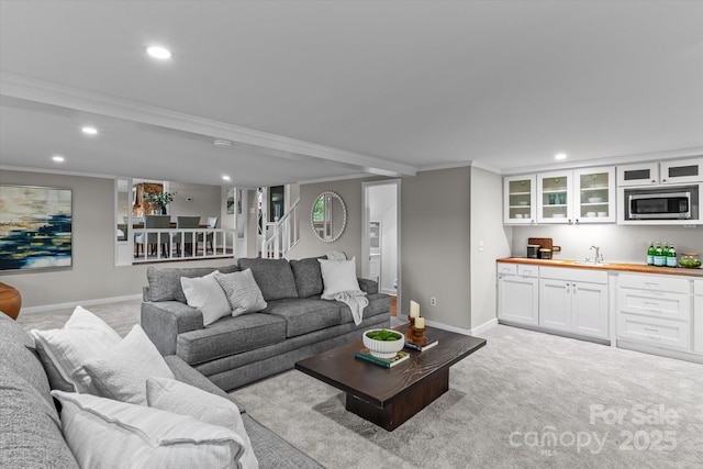 230 Shady Cove Rd, Troutman, NC 28166 - living room with recessed lighting, stairway, light carpet, wet bar, and ornamental molding