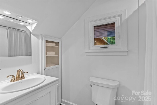 230 Shady Cove Rd, Troutman, NC 28166 - bathroom featuring vanity, toilet, baseboards, and a shower with curtain