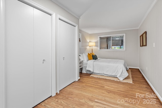 230 Shady Cove Rd, Troutman, NC 28166 - bedroom featuring light wood-style flooring, crown molding, and baseboards