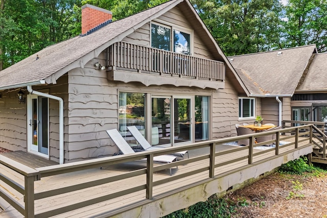 230 Shady Cove Rd, Troutman, NC 28166 - back of property featuring a shingled roof, a chimney, a balcony, and a wooden deck