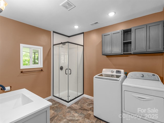 280 Noland Dr, Clyde, NC 28721 - laundry room with cabinet space, independent washer and dryer, baseboards, stone finish flooring, and recessed lighting