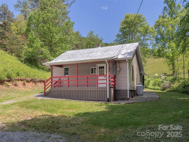 280 Noland Dr, Clyde, NC 28721 - view of front of house featuring a front lawn and metal roof