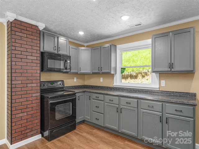 280 Noland Dr, Clyde, NC 28721 - kitchen with black appliances, gray cabinets, a textured ceiling, dark countertops, and ornamental molding