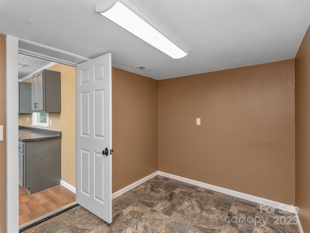 280 Noland Dr, Clyde, NC 28721 - bonus room featuring baseboards and stone finish floors