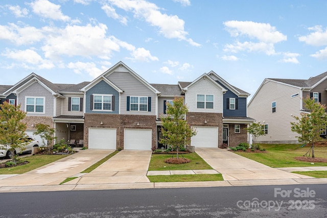 6011 Chelsea Oaks Rdg, Tega Cay, SC 29708 - view of front of home featuring driveway, brick siding, and an attached garage