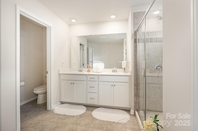 6011 Chelsea Oaks Rdg, Tega Cay, SC 29708 - full bath featuring double vanity, toilet, a stall shower, tile patterned flooring, and recessed lighting