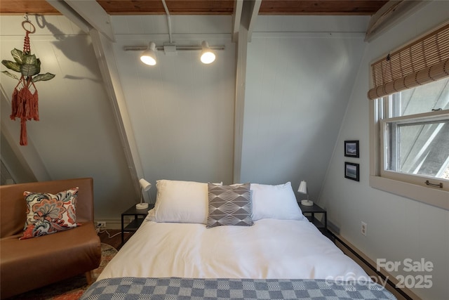 bedroom featuring beam ceiling