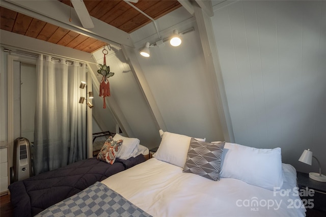 bedroom featuring beam ceiling and wooden ceiling