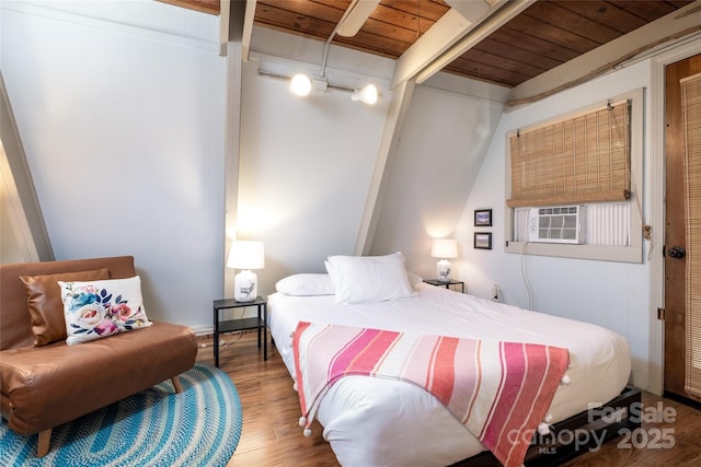 bedroom featuring wood finished floors and wood ceiling