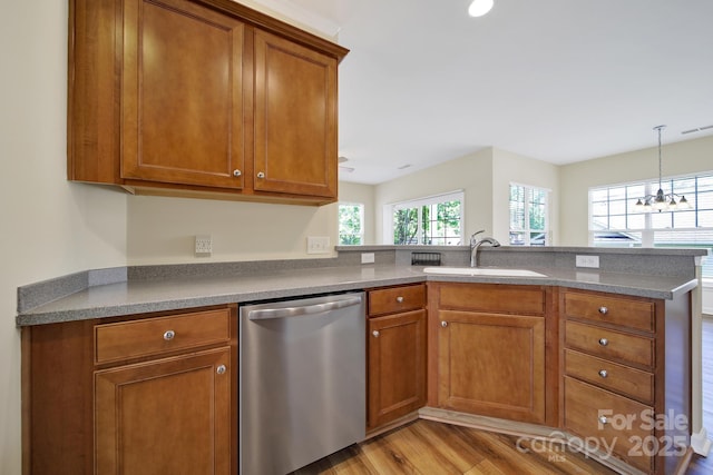 28129 Song Sparrow Ln, Fort Mill, SC 29707 - kitchen with stainless steel dishwasher, brown cabinetry, and a sink