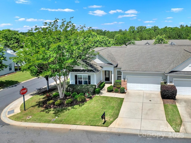 28129 Song Sparrow Ln, Fort Mill, SC 29707 - view of front of property with driveway, a garage, a front lawn, and a shingled roof