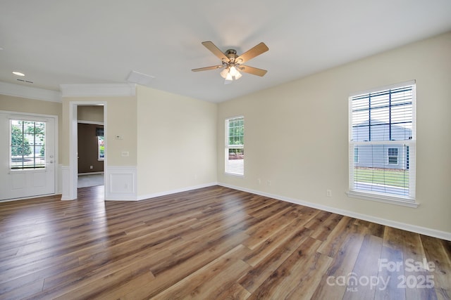 28129 Song Sparrow Ln, Fort Mill, SC 29707 - unfurnished room featuring wood finished floors, ceiling fan, and a wainscoted wall