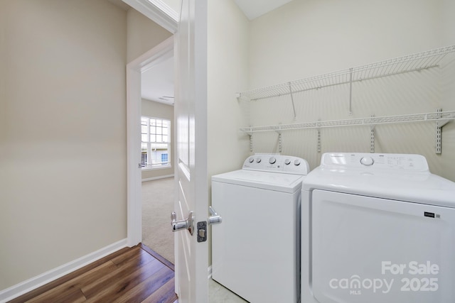 28129 Song Sparrow Ln, Fort Mill, SC 29707 - laundry area with washer and clothes dryer, wood finished floors, and baseboards