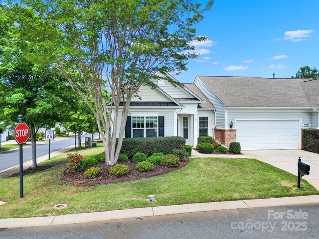 28129 Song Sparrow Ln, Fort Mill, SC 29707 - view of front of property featuring a garage, driveway, a front yard, and brick siding