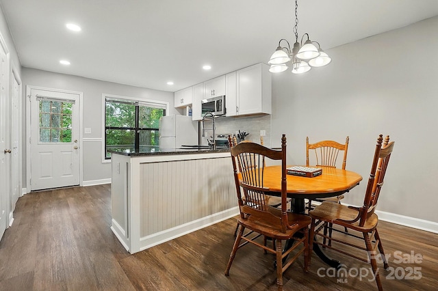 392 Tall Oaks Trl, Fort Mill, SC 29715 - dining space featuring dark wood-type flooring, recessed lighting, baseboards, and a chandelier