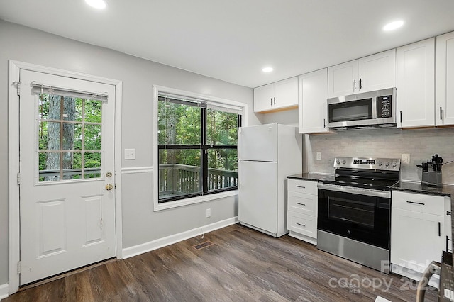 392 Tall Oaks Trl, Fort Mill, SC 29715 - kitchen with appliances with stainless steel finishes, dark wood-type flooring, dark countertops, white cabinets, and recessed lighting