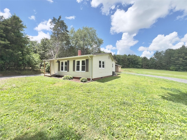 2482 E NC-10 Hwy, Conover, NC 28613 - view of property exterior featuring a chimney, a yard, and crawl space