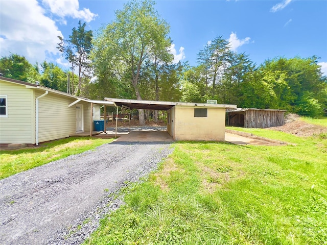 2482 E NC-10 Hwy, Conover, NC 28613 - single story home featuring driveway, a carport, and view of scattered trees