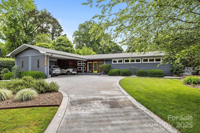 2121 Valencia Ter, Charlotte, NC 28226 - ranch-style home with an attached carport, a front lawn, and driveway