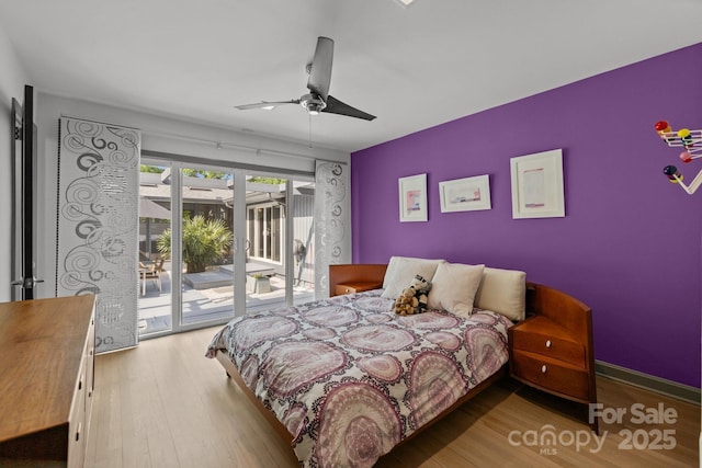 2121 Valencia Ter, Charlotte, NC 28226 - bedroom featuring access to outside, wood finished floors, and ceiling fan