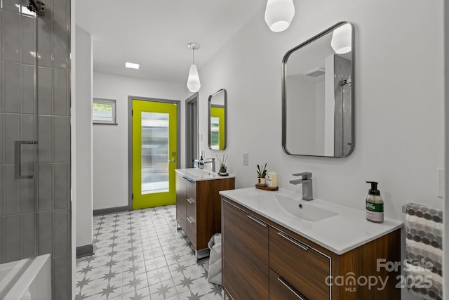 2121 Valencia Ter, Charlotte, NC 28226 - bathroom with tile patterned floors, two vanities, and a shower