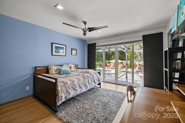 2121 Valencia Ter, Charlotte, NC 28226 - bedroom featuring wood finished floors, access to outside, ceiling fan, and baseboards