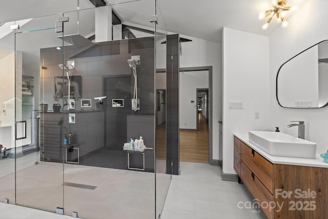 2121 Valencia Ter, Charlotte, NC 28226 - bathroom featuring a shower stall, vanity, baseboards, and high vaulted ceiling