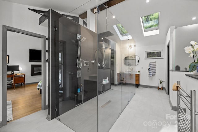 2121 Valencia Ter, Charlotte, NC 28226 - bathroom featuring a shower with shower door, a skylight, high vaulted ceiling, and baseboards