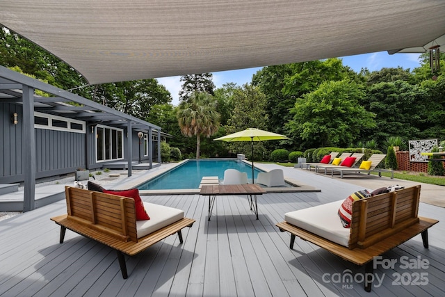 2121 Valencia Ter, Charlotte, NC 28226 - outdoor pool with a wooden deck, an outdoor hangout area, and view of wooded area