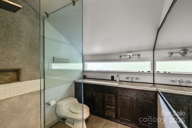 2121 Valencia Ter, Charlotte, NC 28226 - full bathroom featuring toilet, vanity, tile patterned floors, and backsplash