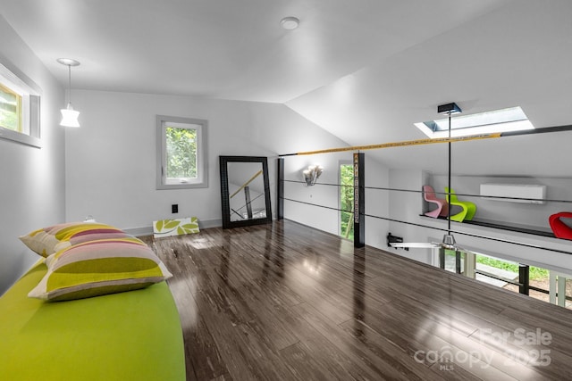 2121 Valencia Ter, Charlotte, NC 28226 - workout room featuring wood finished floors, healthy amount of natural light, vaulted ceiling, a skylight, and baseboards