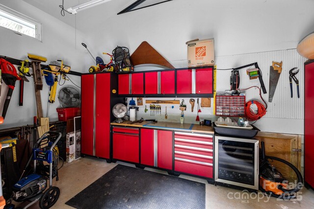 2121 Valencia Ter, Charlotte, NC 28226 - garage with a workshop area and beverage cooler