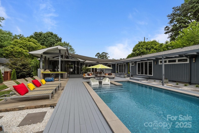 2121 Valencia Ter, Charlotte, NC 28226 - swimming pool featuring a patio, outdoor lounge area, and a wooden deck