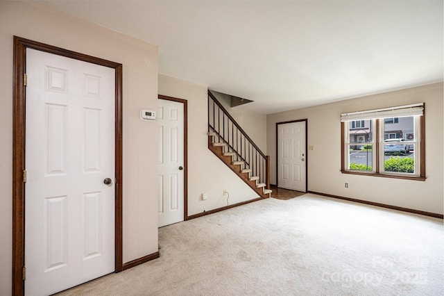 1330 5th St NE Unit 145, Hickory, NC 28601 - foyer entrance featuring light colored carpet, stairs, and baseboards