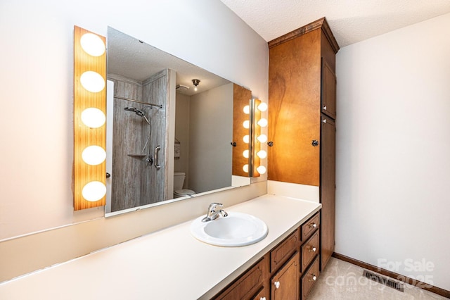 1330 5th St NE Unit 145, Hickory, NC 28601 - full bath featuring toilet, a textured ceiling, vanity, a shower, and baseboards