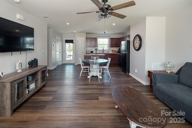 dining room featuring baseboards, ceiling fan, dark wood-style flooring, and recessed lighting