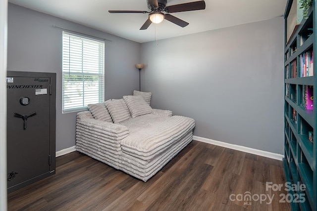 bedroom featuring dark wood finished floors, baseboards, and ceiling fan